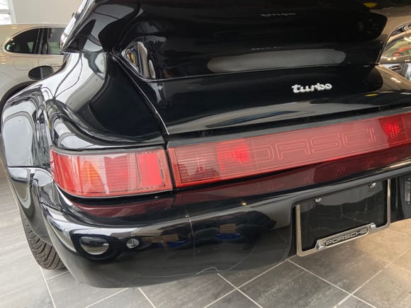 Aftermarket 964-style taillights cracked and missing hardware - they like to fall out under hard acceleration. 