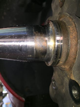 Wear or corrosion mark on inner bearing race, at approximately 5 o'clock.