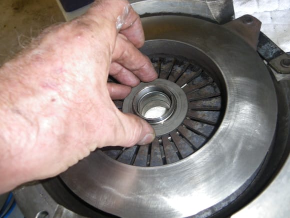 Installing large washer? on inside face of pressure plate prior to installation of clip that hold the throw out bearing to the pressure plate fingers
