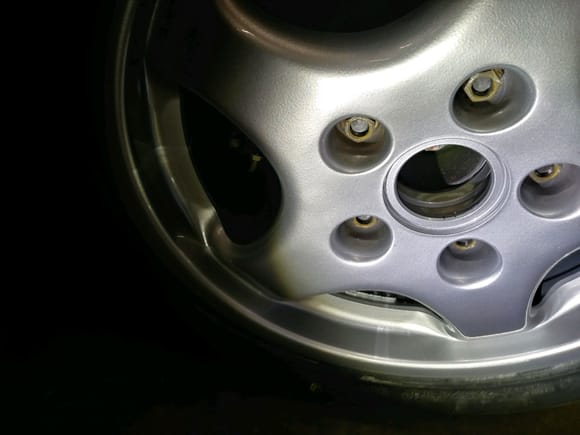 Steel lug nuts on 45mm studs with H&R 7mm spacer.