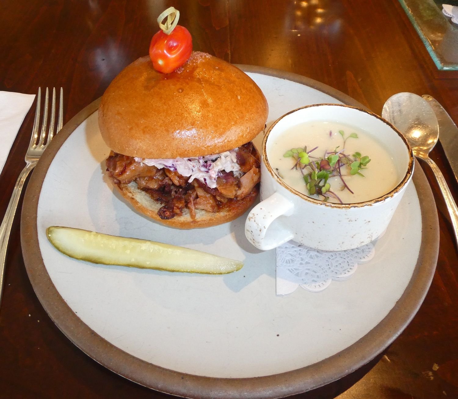 Unique style Pulled Pork sandwich with Sweet Onion soup.