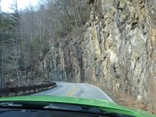 The twisty narrow road to and from Highlands with close rock walls.