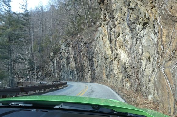 The twisty narrow road to and from Highlands with close rock walls.