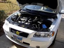 That funny section of hose attached with blue zip ties is a temporary brace for the air intake duct. The duct detaches from the grill area due to minor movement of the heat shield when the engine torques. A better solution is in the works :)