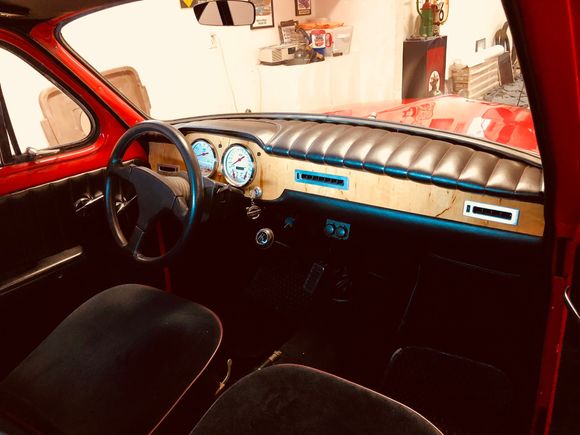 Full customized dash using Alder wood and tuck and rolled dash pad to match the seats