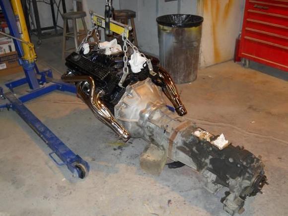 The 350 ready for installation.  Given the tight quarters, it was easier to bolt up everything outside the vehicle. It's a bone-stock, truck-tuned throttle body engine, freshly rebuilt.