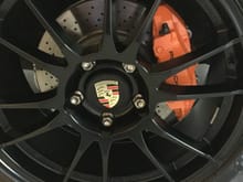 painted while on the car with VHT brake caliper paint then cleared after sticker was applied rated at 600 degrees