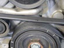 After removing the radiator assembly, you may find you need to replace the serpentine belt like mine here in the picture
