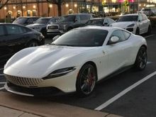 Interesting White Ferrari Roma on Virginia dealer plates parked at a Porsche dealership. 