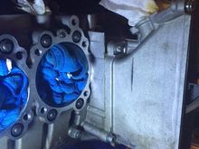 I had to remove the timing chains covers to get to the inside holes as the drill I had would not clear the chain covers. If you had an angle drill or really small drill you wouldn't have to do this.