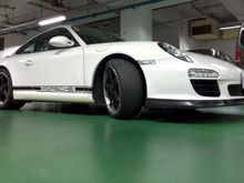 Porsche 997 Mark II Carrera with Sharkwerks lowered springs, FUCHS replica rims, GT3Tek front lip spoiler, Design911 Ducktail engine cover.