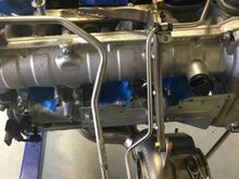 Another cool thing Steve cooked up was modifying the factory turbo hangers and building a turbo/header support to take some stress off of the headers. I haven't seen anyone else doing this, but loved the idea.