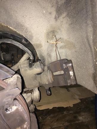 Bentley provides a handy place to dangle the caliper with a bit of wire ...so s not strain the brake line .
