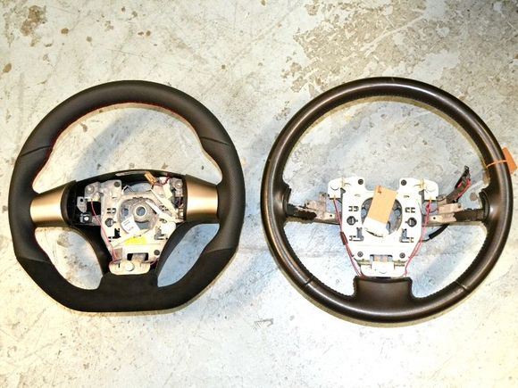 Our sportive steering wheel sitting next to an OE C6 steering wheel