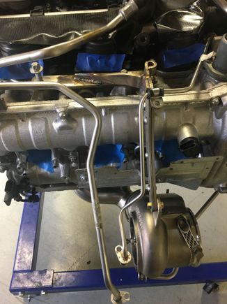 Another cool thing Steve cooked up was modifying the factory turbo hangers and building a turbo/header support to take some stress off of the headers. I haven't seen anyone else doing this, but loved the idea.