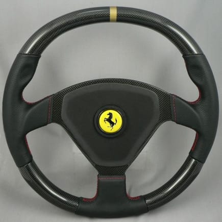 MAcarbon custom Ferrari 360 CS wheel, carbon top and bottom with gold stripe, and red stitching