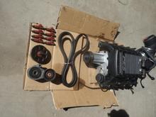 Supercharger, belt, tensioner, roller and injectors.