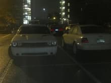 My car and a white bare bones automatic challenger