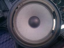 Factory speaker. Not just blown but in tatters. It is a 1998 after all. My speakers are 6.5". The stock speakers were three screw, but the mounting area had a four screw mount configuration, I think that is for the Bose speakers. So the new one just screwed right in. I had to find new screws to use that were bigger than the three factory screws.