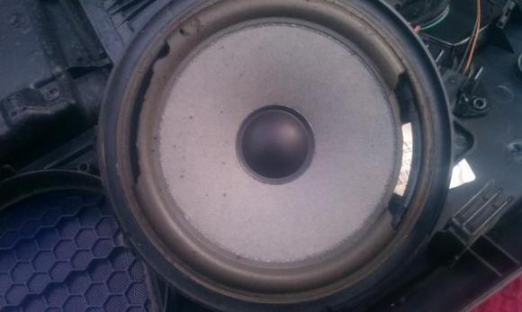 Factory speaker. Not just blown but in tatters. It is a 1998 after all. My speakers are 6.5". The stock speakers were three screw, but the mounting area had a four screw mount configuration, I think that is for the Bose speakers. So the new one just screwed right in. I had to find new screws to use that were bigger than the three factory screws.
