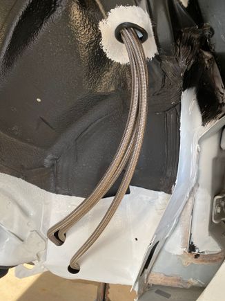 This is where the stainless lines come in to the driver side wheel, well utilizing holes in the frame that way they are protected, as well as they will be behind a fender well.