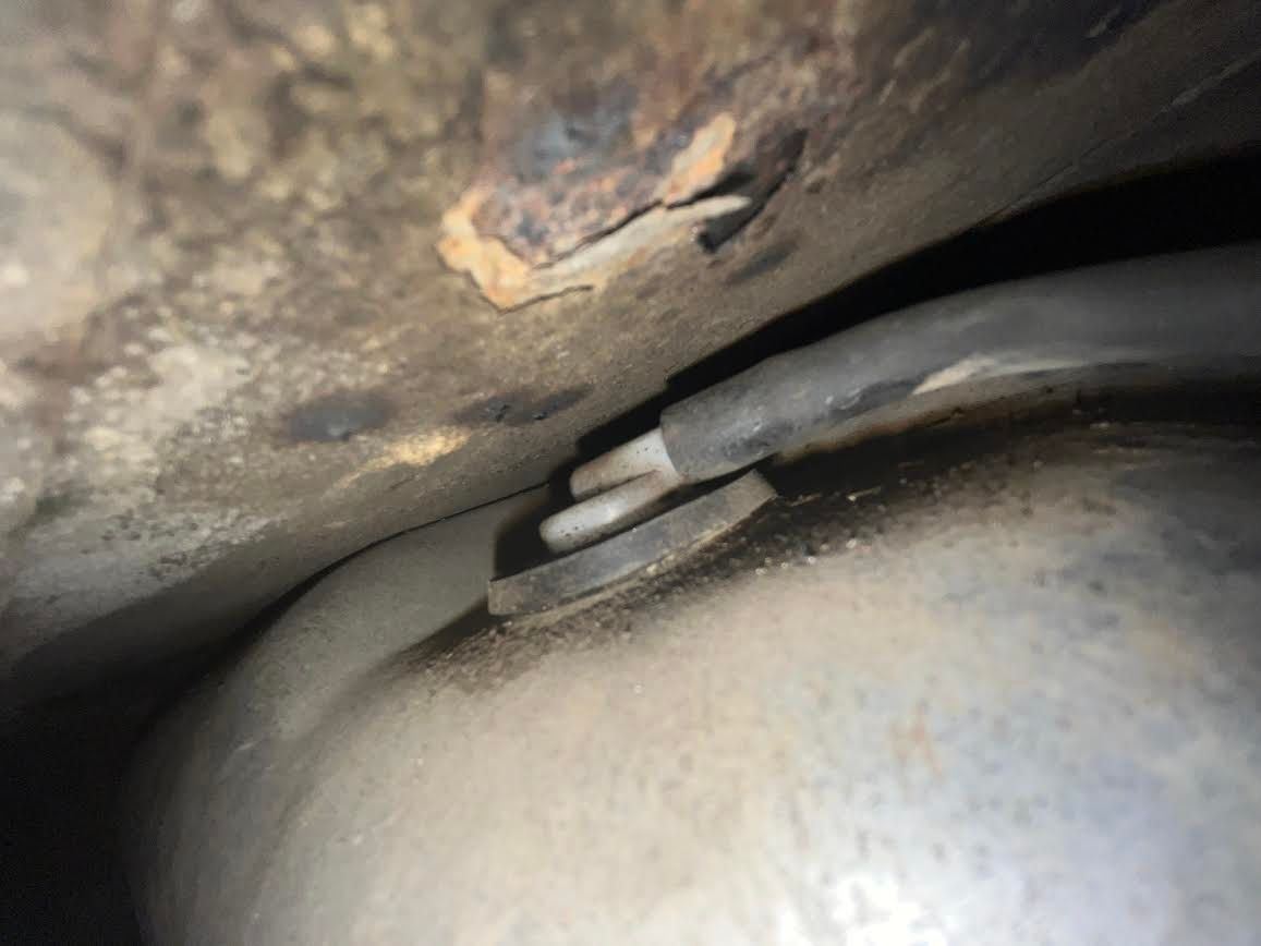 This is where the leftmost hose plugs into on top of the gas tank.