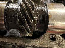 The distributor drive gear is really worn down. My boss said that was the source of my noise, and my slight misfire