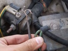 noticed this whack attachment of this black wire instead of a ring terminal. possibly rubbed and exposed wires on other wire?