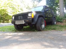 Low, 4x4, red ebay mudflaps, wheel spacers, turbocharged. 