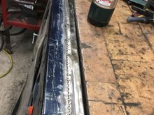 To get a good, tight edge I heated up the sheet metal with a propane torch till it just started to turn color, then tapped it over with a hammer.