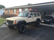 Wind deflector on and jack mounted with some bolts. Nice to have it drivable again.