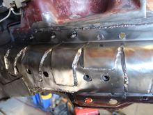 Plasma cutter used to shape and cut holes to allow access to the original threaded bungs and original studs in case I want to use them for anything later.
Bottom left shows how a layered "L" bracket was fabricated to tie into the Rustys stiffeners that were used along the full length of the lower "frame rails"