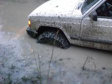 sitting in a spot that people down here in SC are afraid of. made to there in two wheel  then i had to lock it in four wheel cause the black river muck sinks pretty past. and the dumb ass behind me got stuck so i had to wait till the buddy behind him winch is 1500 out. when i get my snorkle im going to cross it and post more pics in the middle