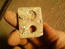 here you can see the THREE tack welds that hold it in place, in a triangle shape.