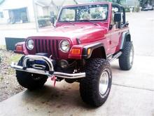 My TJ once it was done, Dana 30/44 with locker in rear, 4" Procomp, 3" body (it came with Jeep),  35" Goodyear MTR, Rough Country Winch,