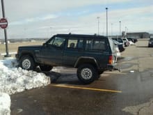 Trying to flex at school. Couldn't get any higher than that since i had both front and rear swaybars connected and my rear wheels were on block ice.