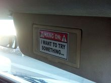 Sticker on passenger sun visor