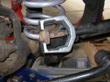 Use tie-rod puller to remove sway bar pin