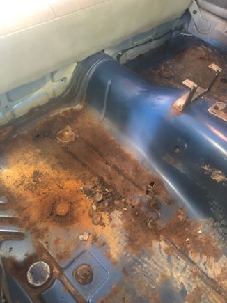 Paper thin here in the passenger rear, will probably do full length mopar floor pan for this side. 