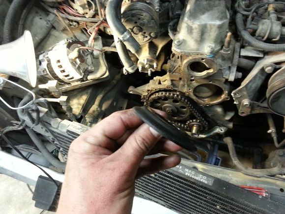 Pull the oil slinger off.  Open side faces out