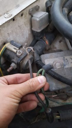 noticed this whack attachment of this black wire instead of a ring terminal. possibly rubbed and exposed wires on other wire?