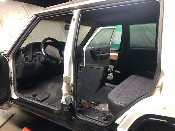 I began throwing the interior back together as well. Center console, rear seat, seat belts and pillar trim. 

I’ve made a long list of junkyard parts necessary for me to finish assembling the interior and install the rear door. I need some misc. hardware and shims for the rear door. Just waiting for the weather to warm up a bit to go out and pull parts! 