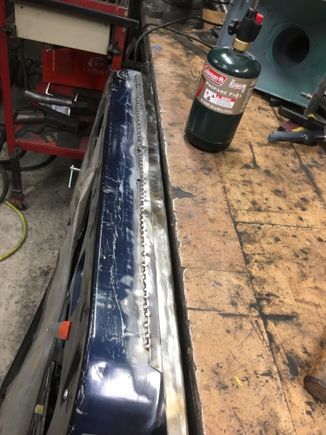 To get a good, tight edge I heated up the sheet metal with a propane torch till it just started to turn color, then tapped it over with a hammer.