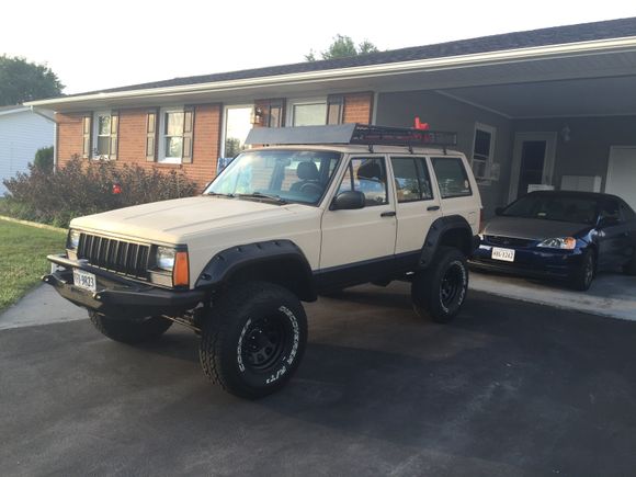 Wind deflector on and jack mounted with some bolts. Nice to have it drivable again.
