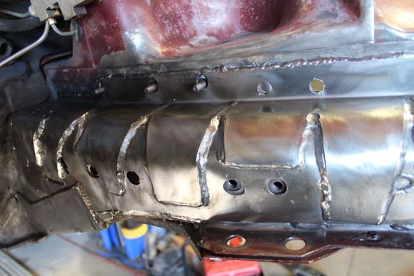 Plasma cutter used to shape and cut holes to allow access to the original threaded bungs and original studs in case I want to use them for anything later.
Bottom left shows how a layered "L" bracket was fabricated to tie into the Rustys stiffeners that were used along the full length of the lower "frame rails"