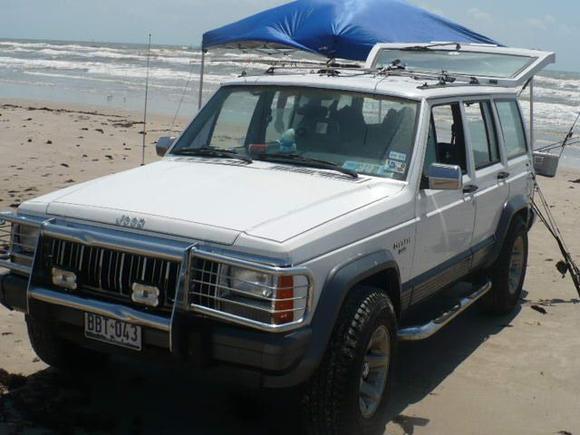 With grill guard and nerf bars.