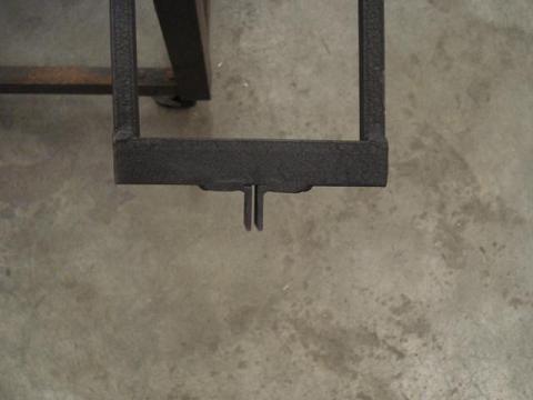 This slides onto the bumper brackets, and then a quick release hold it into place.