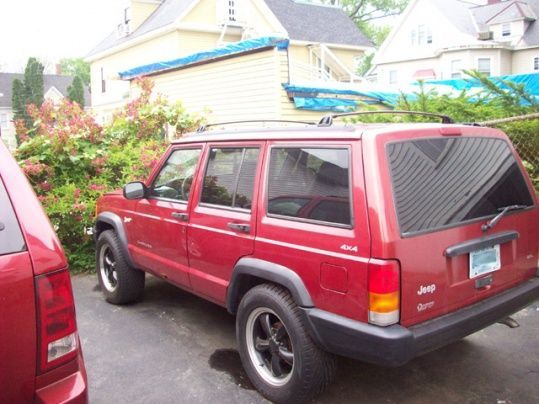 My '98 XJ - and the Wife's '06 Grand peeking in