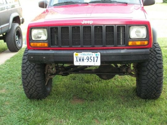 My oldest sons 98 xj after 5.5 iron rock long arm lift and 32 gy dura tracks at's.