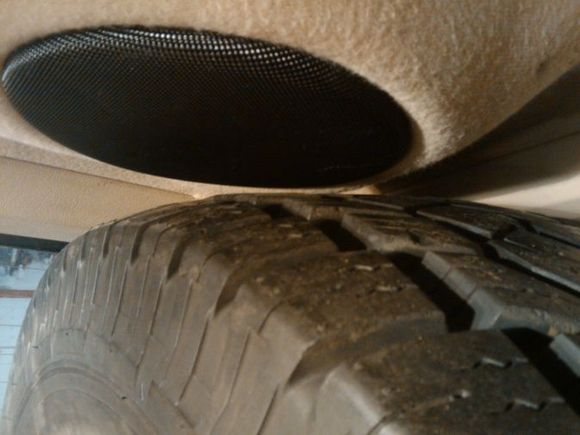 i was able to leave the speaker bar in by fliping it around.